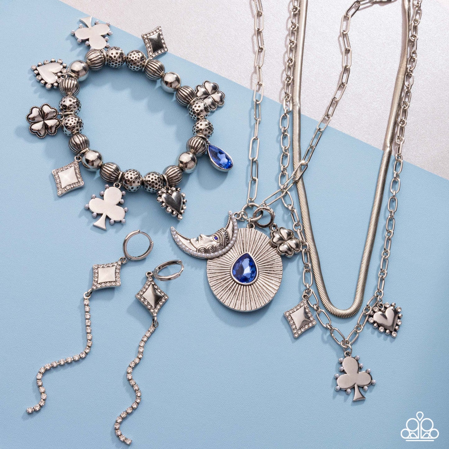 Necklace: "Stirring Season - Blue" Hoop Earring: "Soft-Hearted Sentiment - White" Bracelet: "Spirited Sentiment - Blue" Necklace: "Sentimental Sunset - White"