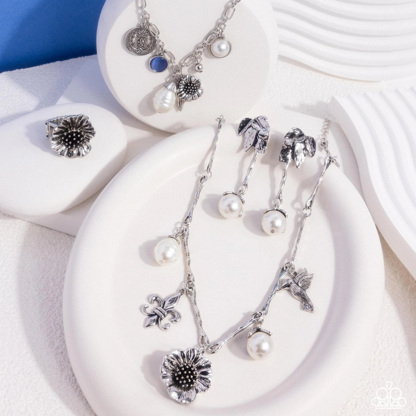 Necklace: "Vintage Vibe - White" Post Earring: "Nod to the Classics - White" Bracelet: "Enduring Energy - Blue" Ring: "Antique Adornment - Silver