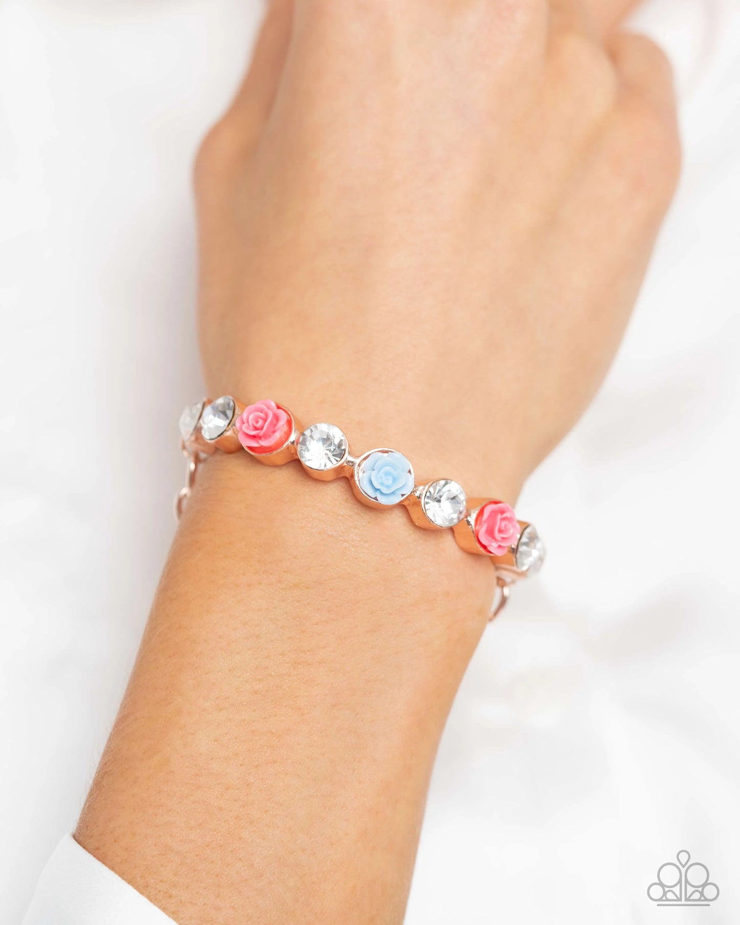 Bracelet: "Reawakening Revelry - Rose Gold" Hoop Earring: "Reawakening Radiance - Rose Gold