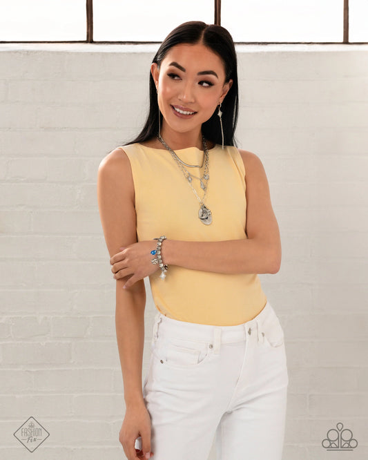 Necklace: "Stirring Season - Blue" Hoop Earring: "Soft-Hearted Sentiment - White" Bracelet: "Spirited Sentiment - Blue" Necklace: "Sentimental Sunset - White"