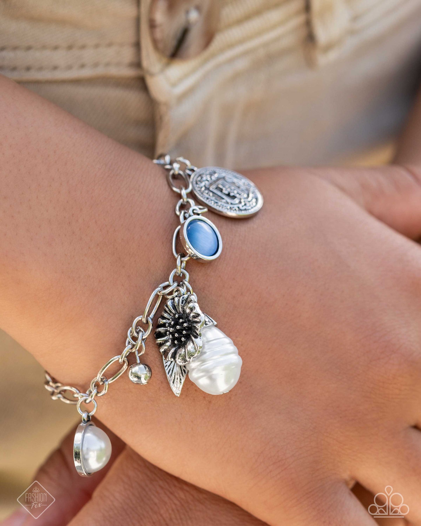 Necklace: "Vintage Vibe - White" Post Earring: "Nod to the Classics - White" Bracelet: "Enduring Energy - Blue" Ring: "Antique Adornment - Silver